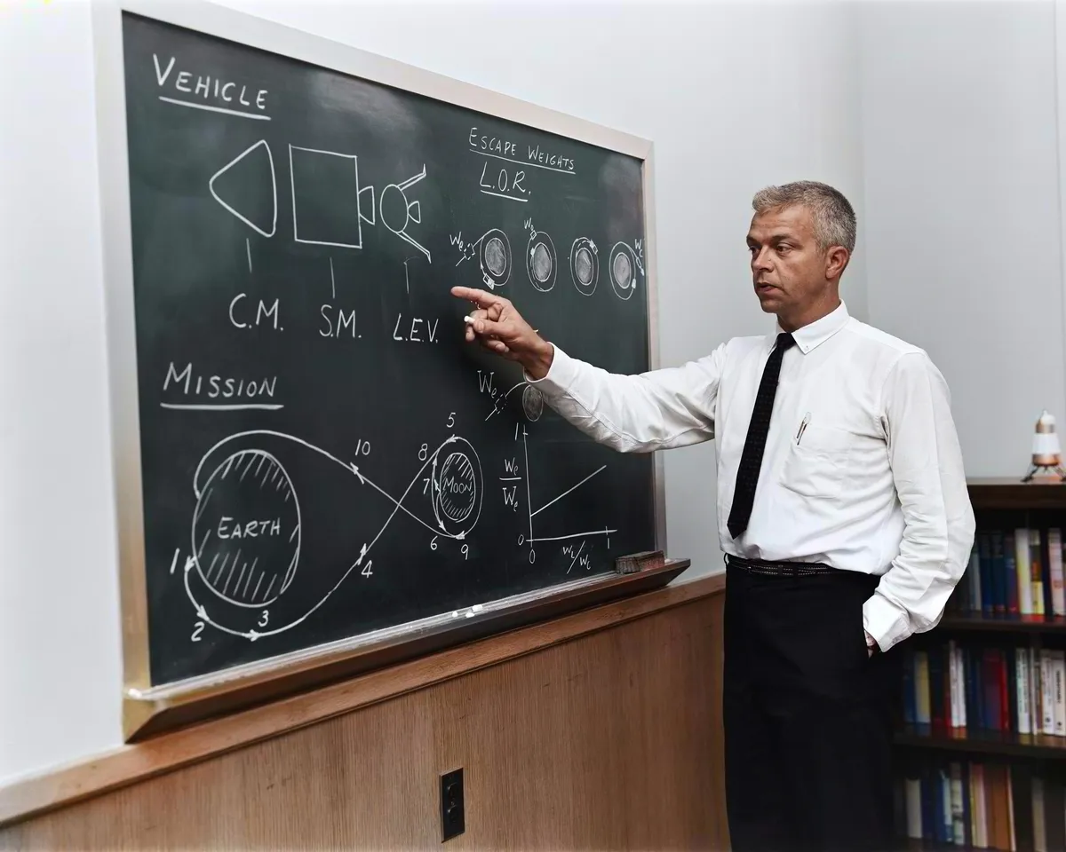 John C. Houbolt at blackboard, showing his space rendezvous concept for lunar landings.