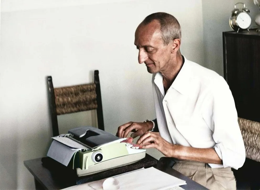 Giorgio Scerbanenco in reading room during the work, in his flat at Lignano City