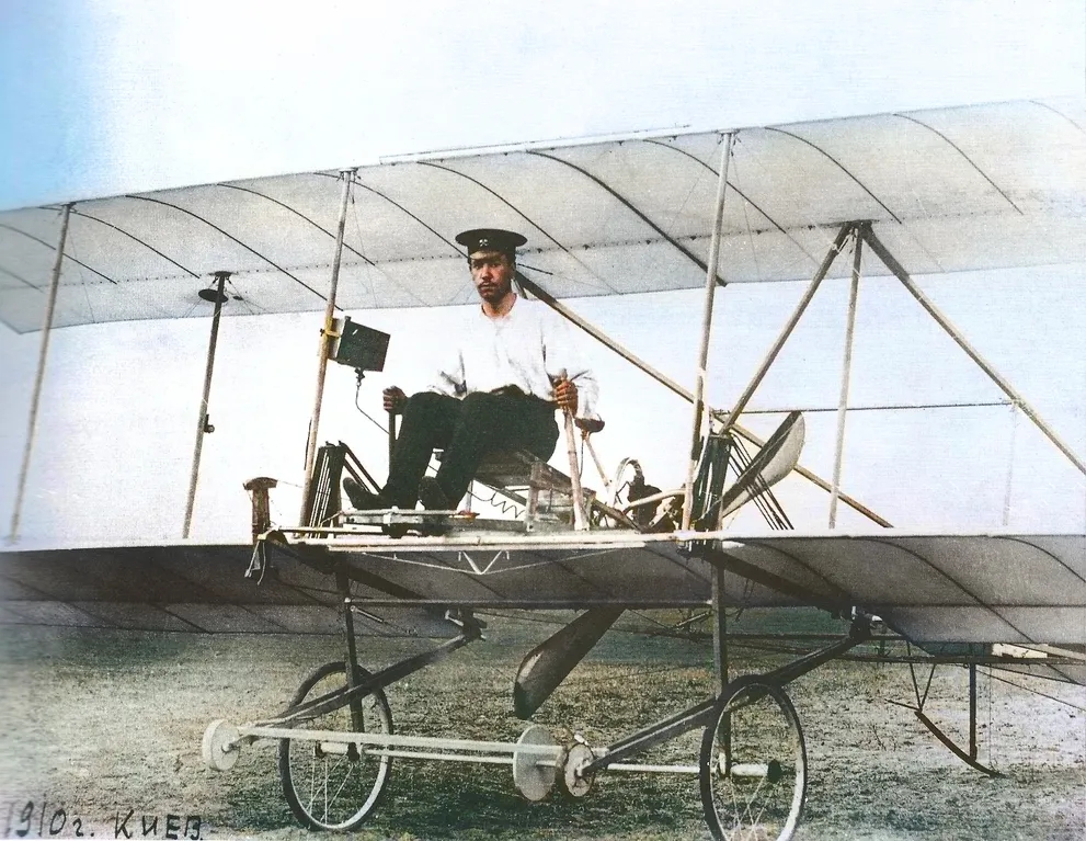 Ihor Sikorsky seated at the forward edge of his first airplane desing, S-1